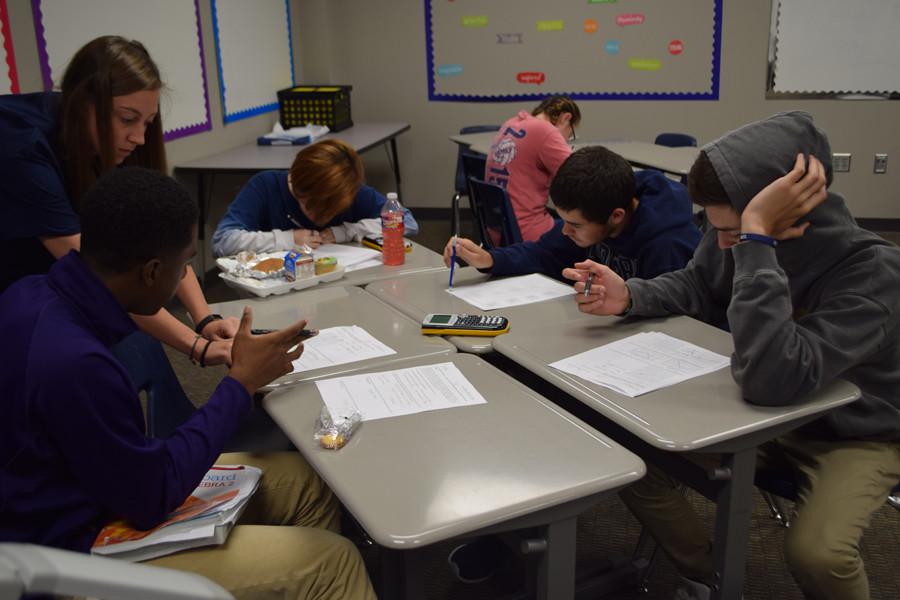 What does this mean? \\ Asking questions, students get the help they need from Mrs. Whisnant during Power Hour Sept. 30.