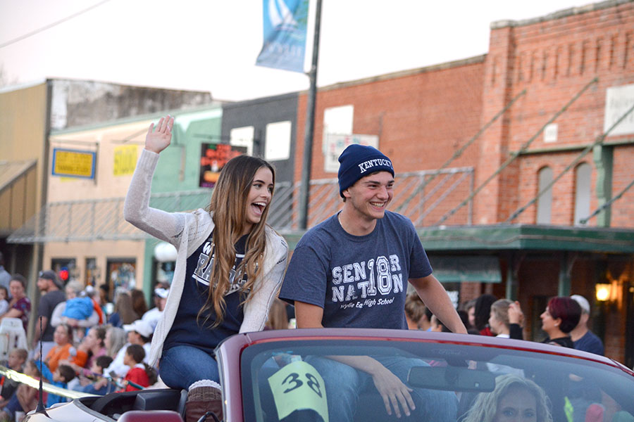 Floating by // Senior hoco nominees Madison Dorethy and Alex Fowler represent the senior class in the annual homecoming parade.