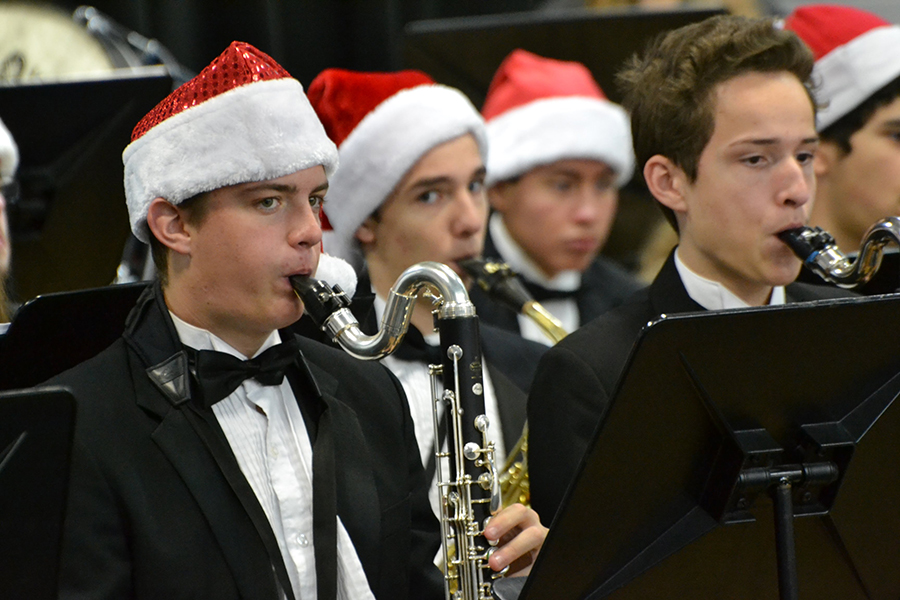 Clarinet Christmas // Playing their bass clarinets, junior Wylie Dunham and freshman Ryan Rodarte spread holiday cheer by performing multiple traditional Christmas pieces at Birmingham Elementary for students during the Wind Symphony elementary tour Dec. 12.