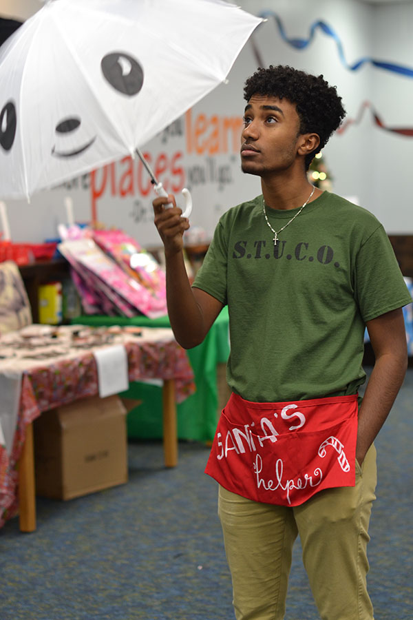 Santa’s helper \\ Student Council president Abel Elias helps out at Burnett Junior High’s school library during the Christmas season. “I felt Student Council was the most active organization for me to get involved with,” Elias said. Student Council works on an assortment of activities every year to improve the community.