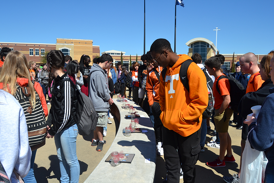 Supportive Raider \\
Silently paying his respects for the lost lives at Parkland, senior and staff reporter Kieron Hunter takes part in the memorial on Unity Day during the beginning of lunch. “It really brought everything into perspective,” said Hunter. “You hear it all the time on the news how someone died but they really never show their pictures. Actually seeing the pictures of the victims really showed that they were just everyday people.”