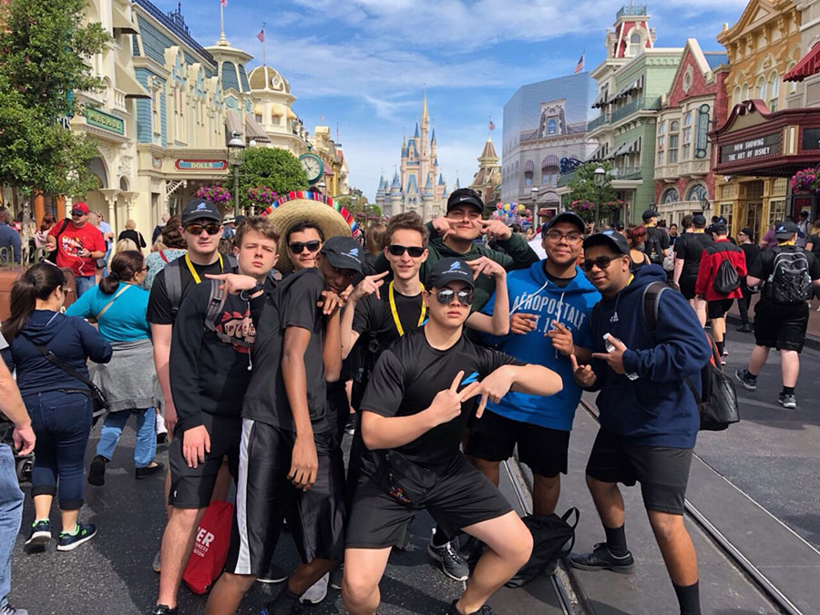 Making magic // Posing in front of Cinderella’s Castle, students enjoy their last day at Disney World’s Magic Kingdom March 10. Fine Arts students traveled to Orlando to march in a Disney parade.