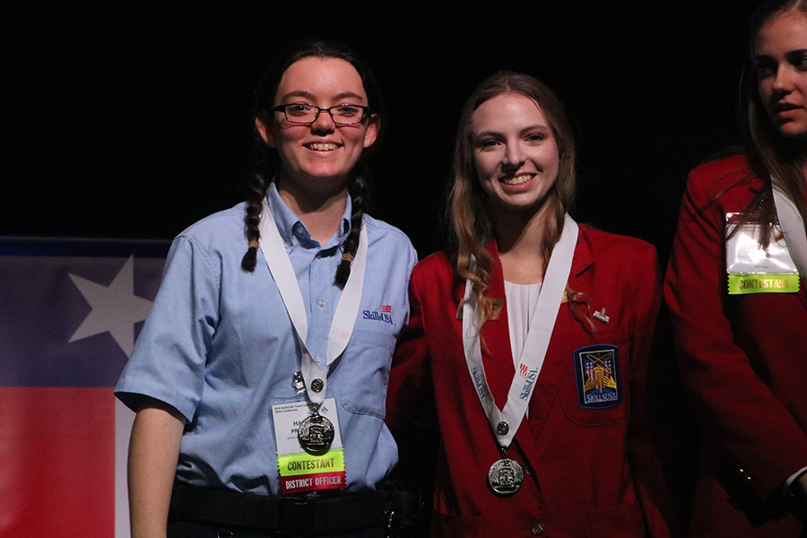 Stage presence \\ Seniors Haley Proctor and McKenna Steiner receive their silver medals, for building search the technical test.