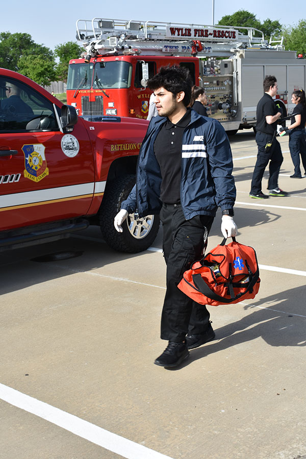 Assessing patients, dressing wounds, and re-enacting a simulated medical emergency, EMT students got hands on experience April 19.