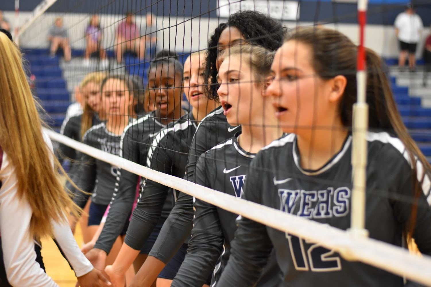 “G’luck” // Wishing Mesquite High School’s varsity volleyball team good luck, the Lady Raiders complete their pre-game obligations. The varsity volleyball team finished second in their district and will play Frisco Wakeland Oct. 30 in a playoff match.
