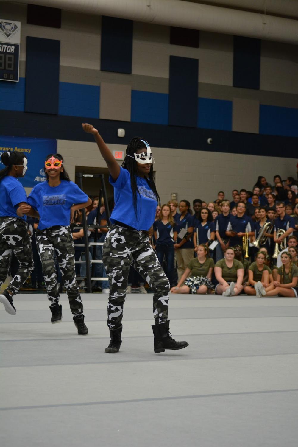 East Side Steppers// Dancing to the music, the step team makes its debut at the camo day pep rally Oct. 14. Everyone who is interested in dance or making rhythm is encouraged to join. Visit with Mrs. Hollie Smith in room 318 for more information.