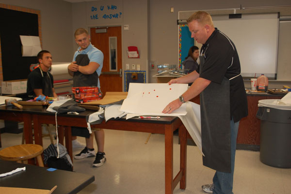 Officer Walter guest speaks in Ms. Millers fourth period forensics class about blood spatter.