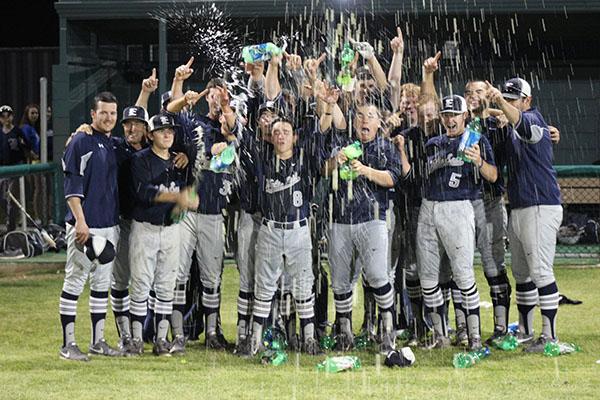 Raining champions // The varsity baseball team wins the district championship April 25.