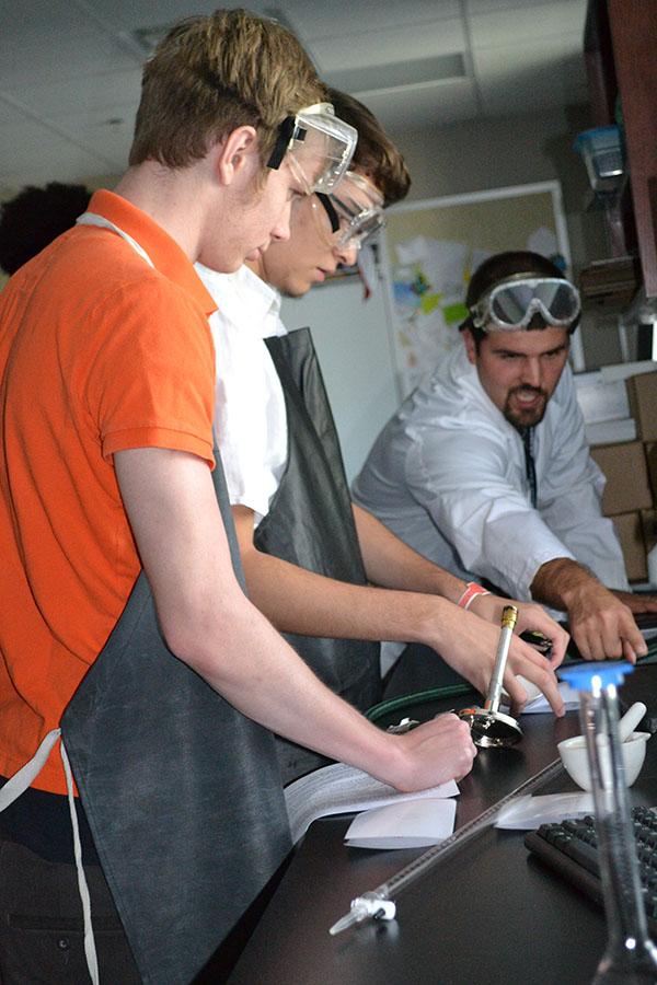 Taking precaution \
Listening to Mr. Peri give instructions Sept. 2, seniors David Crow and Taylor Mauldin prepare their lab.
