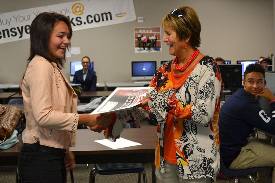 Surprise letter \\ Senior Marissa Padilla is surprised in her journalism class with a letter jacket she earned in tennis.