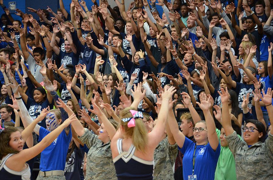 Hands go up \\ Debuting the Raider Rumble Oct. 3 during the crosstown showdown pep rally, the whole student body participated. I cannot believe the turn out, senior cadet Kelsie Mathis said. It is amazing what the Raider Rumble has done to our school spirit.
photo by Caroline Witty