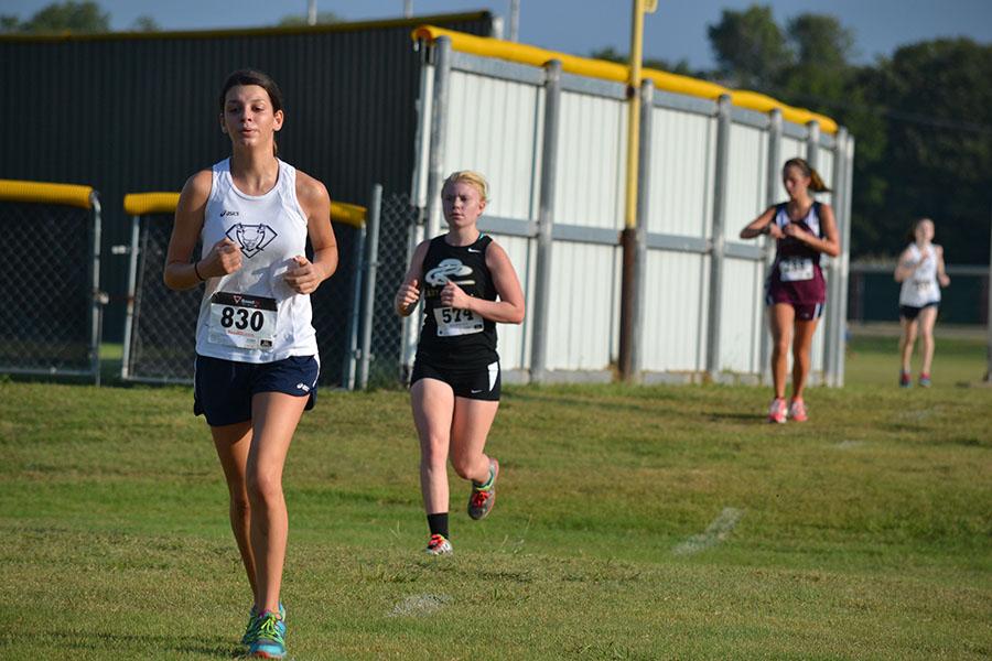 Runnin for cousin \\ Racing at the Wylie High cross country meet Sept. 20, freshman Makayla Marley competes for her cousin, Kate Brennan.