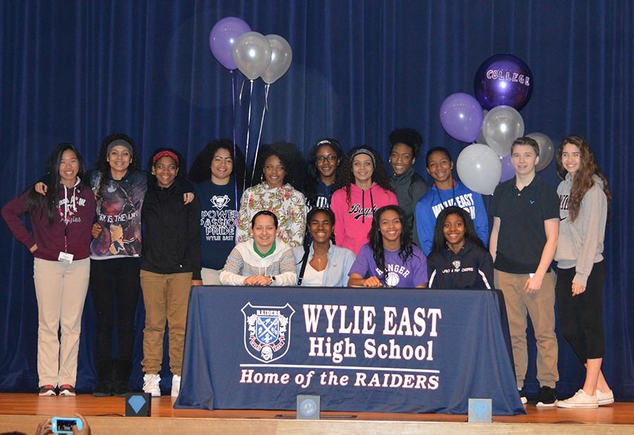 Sign of your life \\ Surrounded by her basketball teammates, senior Jazmin Shields signs a letter of intent to play basketball at Ranger Junior college.