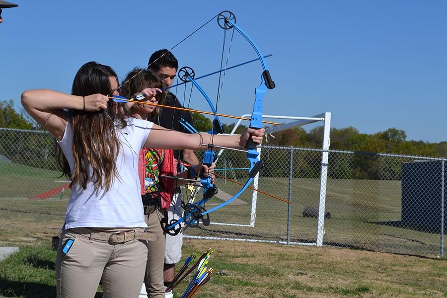 Sharp shooting \ Practicing during coach Jay Jones’s third period class, outdoor adventure students learn how to properly shoot a bow and arrow in front of the baseball fields.
