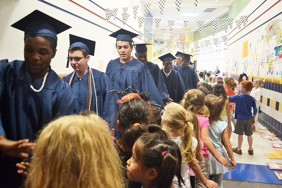 Watkins welcomes \\ Opening just five years ago, Watkins Elementary students lined the hallways congratulating seniors who did not attend a Wylie Elementary.