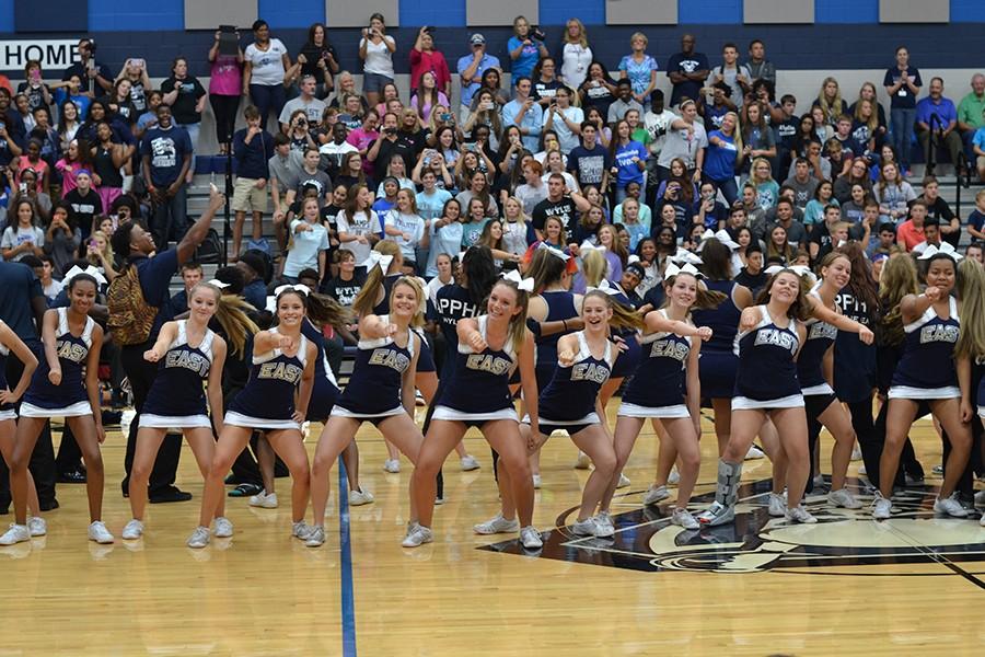 Watch me \\ Cheerleaders lead the student body in the Whip/Nae Nae dance at the first pep rally of the year Sept.28. The first ever morning pep rally is Oct. 2 at 9:10 a.m.