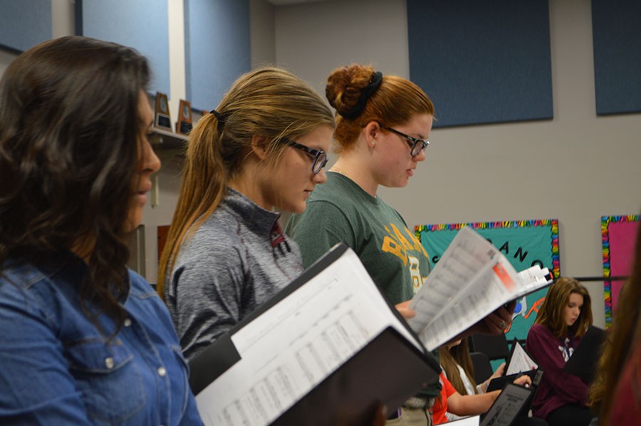 Tune in \\ Sophomores Emily Velasquez, Phoebe Burkman and Kinsey Potts prepare to audition for all region choir. The process is very tedious and time consuming. You have to learn three songs,  Potts said.