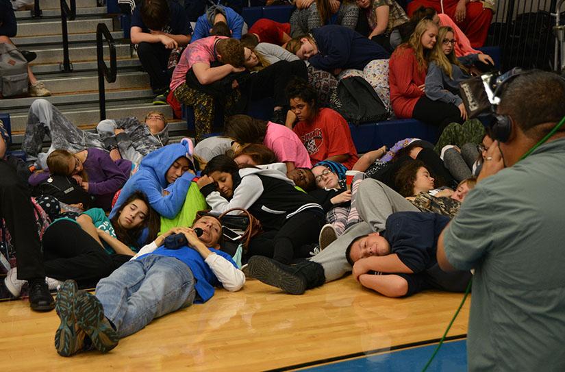 Snooze fest \\ Students pretend to be asleep at WFAA Channel 8s Alarm Clock Pep Rally hosted by Mike Castellucci.