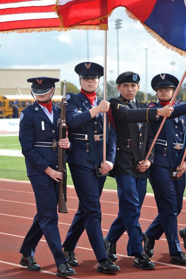 Pride parade \\ JROTC commanders participate in the honored Pass and Review tradition during the Veterans day ceremony. The parade took place at Wylie Stadium from 10:45 a.m. to 11:30 a.m. Nov. 11.