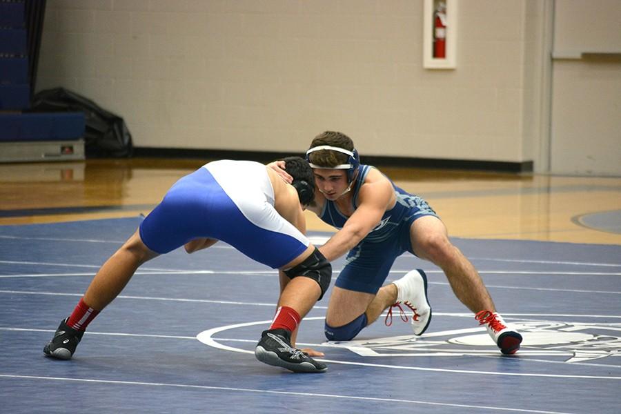 Take down \\ During the wrestling meet Jan. 15 in the gyms, senior Zech Peltier takes charge over his opponent before time ran out.