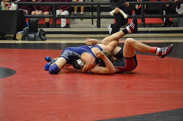 Get the pin \\ Junior Gabe Casey locks down his opponent in a pin, winning his first match of the day.