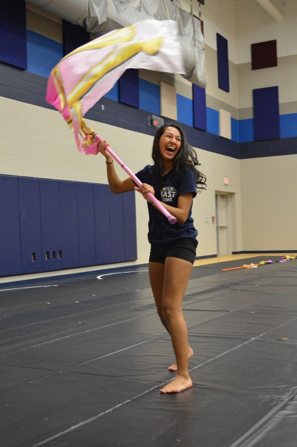 Flags in the air \\ Preparing for their spring competition, sophomore Gissella Martinez will compete at WGI with the varsity winterguard team March 12.