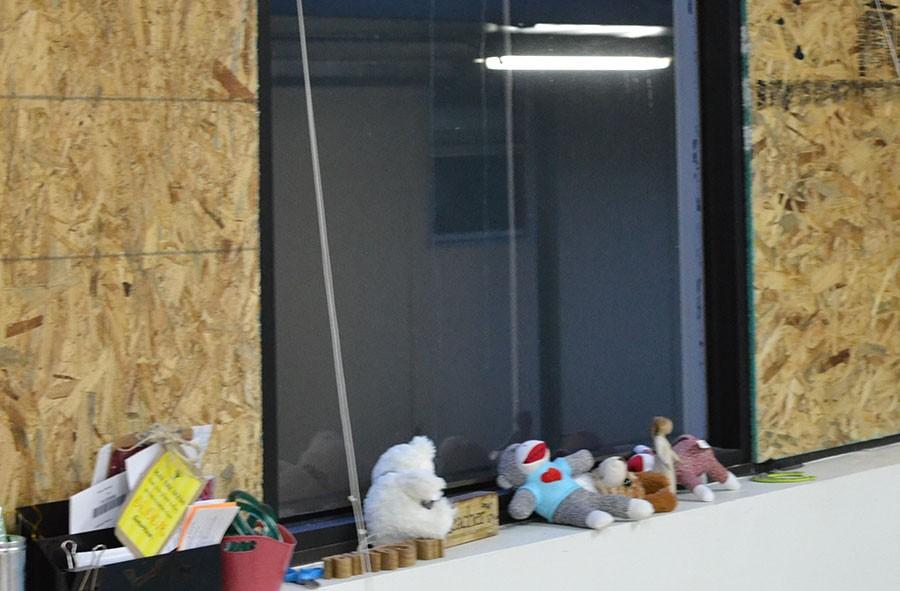 Lovable look outs \\ Stuffed animals align the boarded up windows damaged from the April 11 hail storm in the fourth grade hall at Hartman Elementary. They are watching out for more hail, First Grade Teacher Trona Jurden said.