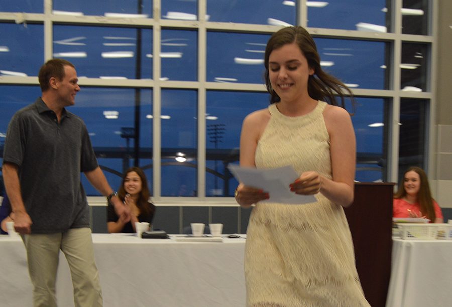 Scholarship recipient \ Senior Maribeth Mills is awarded the $500 journalism scholarship at the first yearbook and newspaper banquet May 16.