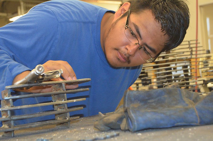 Welding a skull // Sophomore Rodrigo Garcia welds and puts together a skull in hopes that it will be displayed in front of the school when completed. 