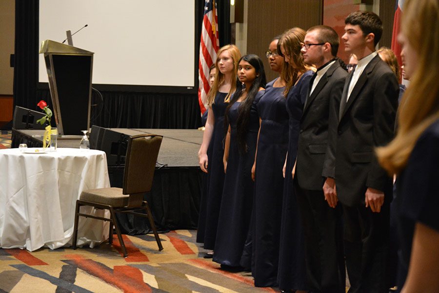 Singing Angels \\ 
Performing for the audience, Acapella members sing at the annual Dallas Veterans Day Banquet at the Reunion Tower in Dallas Nov. 1.  Students missed a day of school to honor those who served the country. 