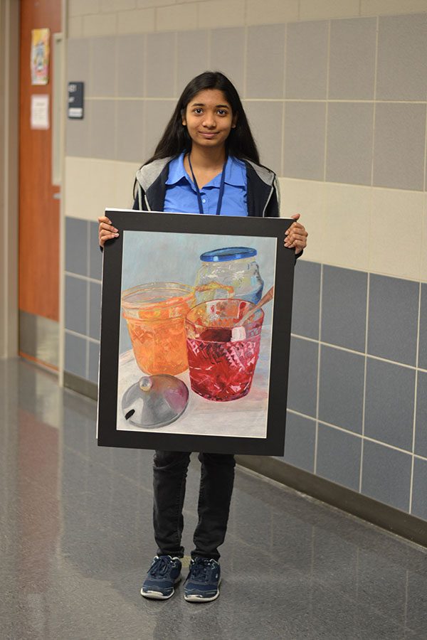 VASE selectives // Posing for pictures freshman Anika Tasnim shows off her art Feb. 18.
