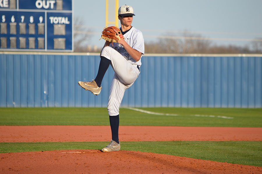 Head up leg up \\ During the last inning of defense, junior Tommy Jennings steps up to pitch the rest of the game. Jennings throws multiple strikes and gets three of the North Forney Falcons out making the Raiders the winners of the first district game of the season. 