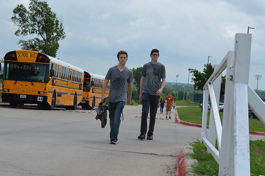 Walk with purpose \\ Honoring the prisoners of war of, The Bataan Death March through the start of a 14 mile walk, junior Ethan Metcalf and sophomore Robert Fredrichsen participate in their third period JROTC class.