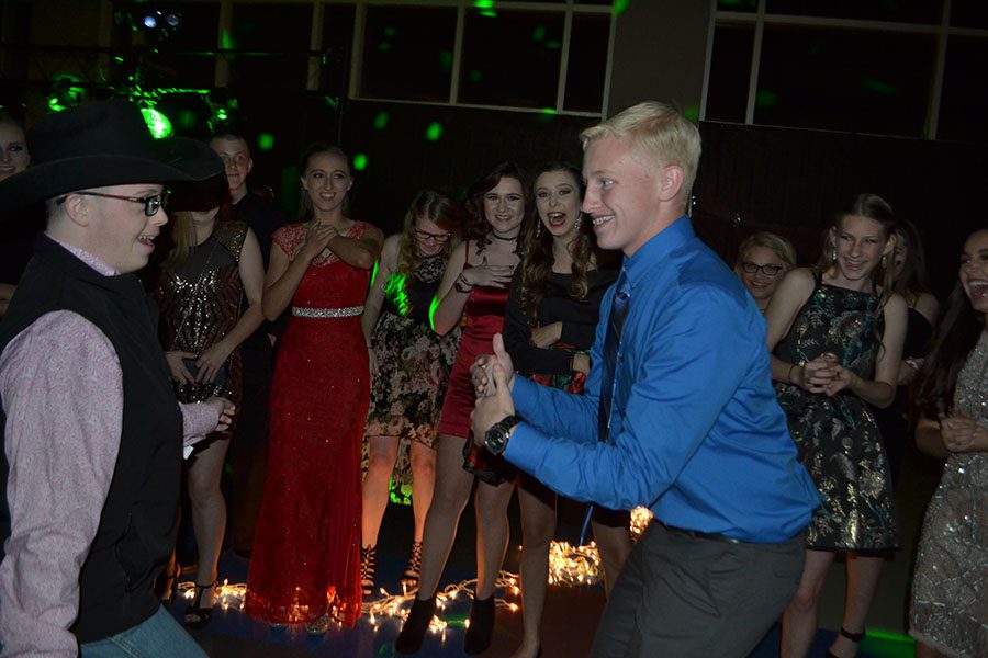 Dance the night away // Jamming out in the middle of a dance circle, sophomore T.K Gaykin and Junior Jordan Murphy attended the homecoming dance last year. Photo by Abby Cox 