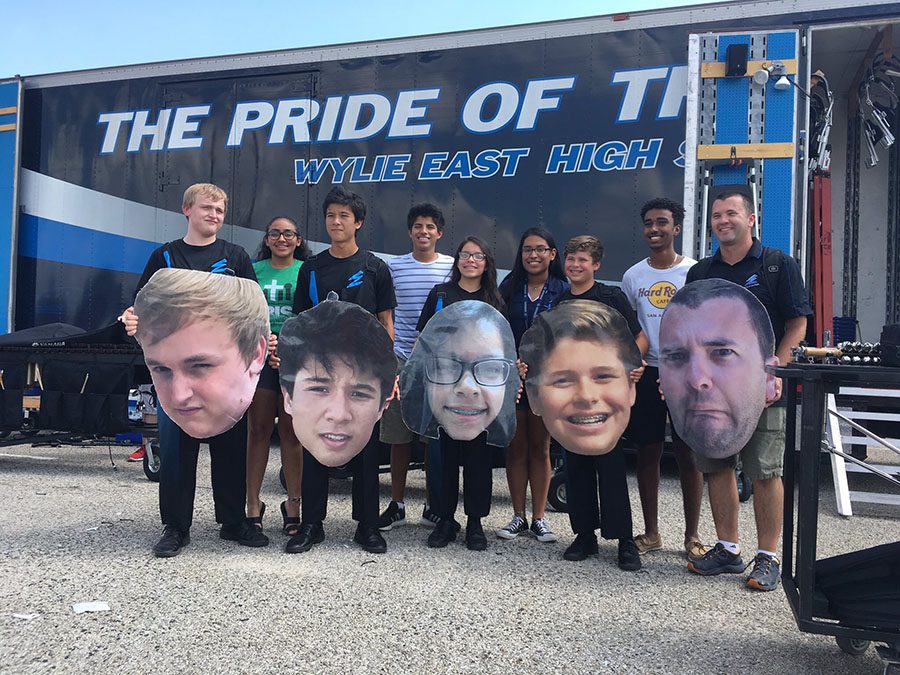 Family of Fat Heads // Posing with wide smiles, percussion members and friends beam in joy of receiving their Fat Heads Sept. 23.  
