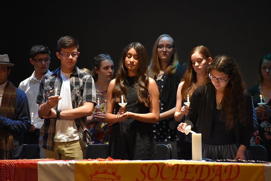 Lighting the way \\ Wylie East High School sophomore Brenna Reyes becomes a Spanish Honors Society member with this ritual April 12. La Sociedad Hispania inducted 32 members into the honor society. The prestigious organization is under the direction of Ms. Katharine Isbell and Ms. Jame Farrar.