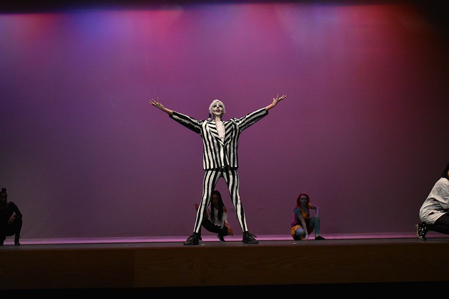 Christmas is ours // Portraying Jack Skellington, senior Thomas Griffeth performs with Hip Hop club at the Sapphires winter showcase Dec. 9. As the closing picture of the yearbook, it dramatically illustrates the theme of capture. 