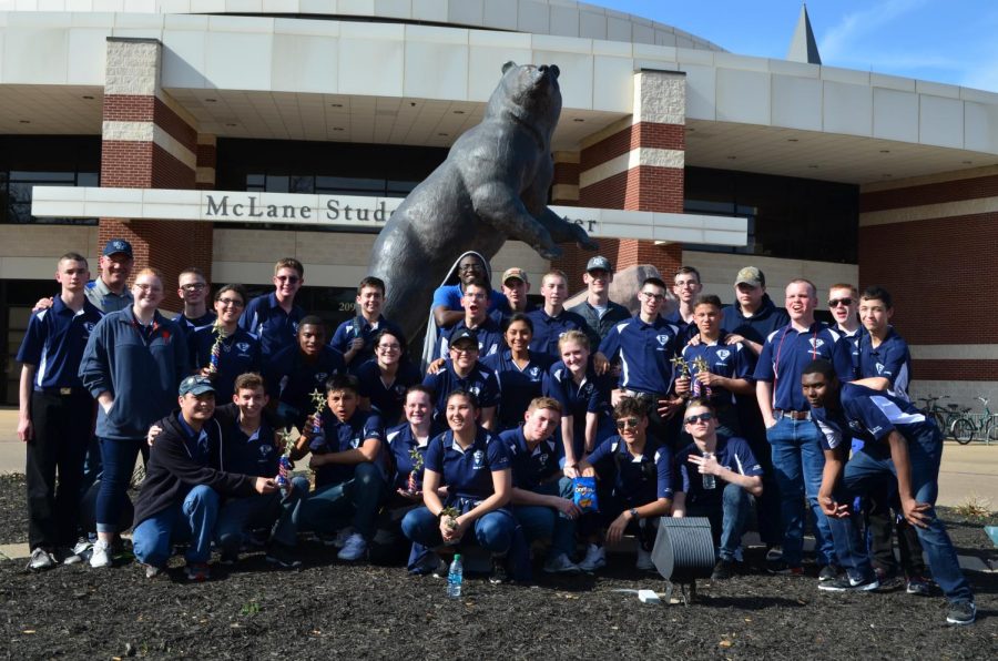 Grin and bear it \\ Completing their competition, AFJROTC poses in front of the infamous bear statue at Baylor University after being named the second overall champion at the second annual Baylor University Competition March 24.