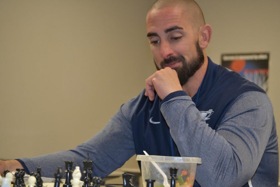 Figuring the puzzle \\ Chess Club sponsor Benjamin Edge is a biology teacher who is involved in chess. “I dont just love teaching students, but I enjoy bonding with them,” Edge said.
