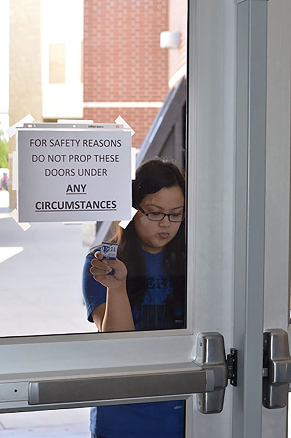Locked out \\ After nationwide school shootings, district beefs up security. All visitors must show identification before doors will unlock to let them in the building.