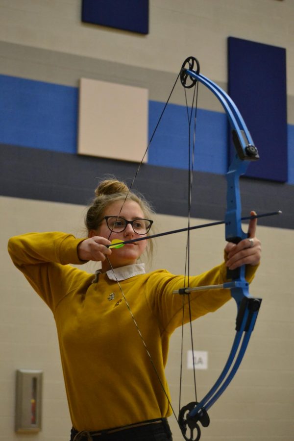 Eye on the prize \\ Aiming at her target, junior Krista Adams practices her archery skills. The archery club meets every Wednesday during Power Hour. Mr. Chris Bailey sponsors the club that is open to all students.