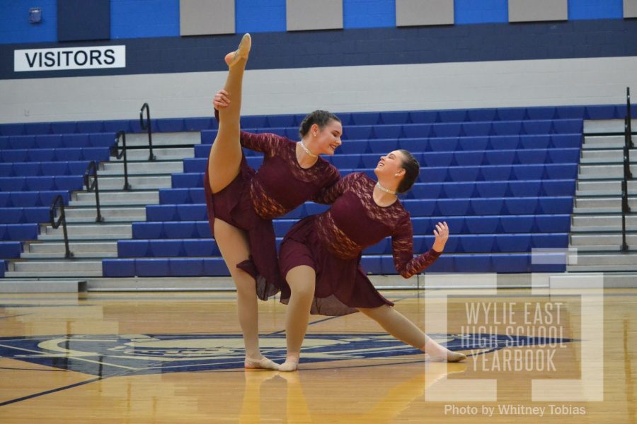 Lean on me \\ Senior Sapphire officers Hannah Mullins and Kylie Combest partnered up during an officer routine in the competition gym Jan. 25. Show offs featured each routine that will compete in the drill team competition at Heath High School Feb. 2.