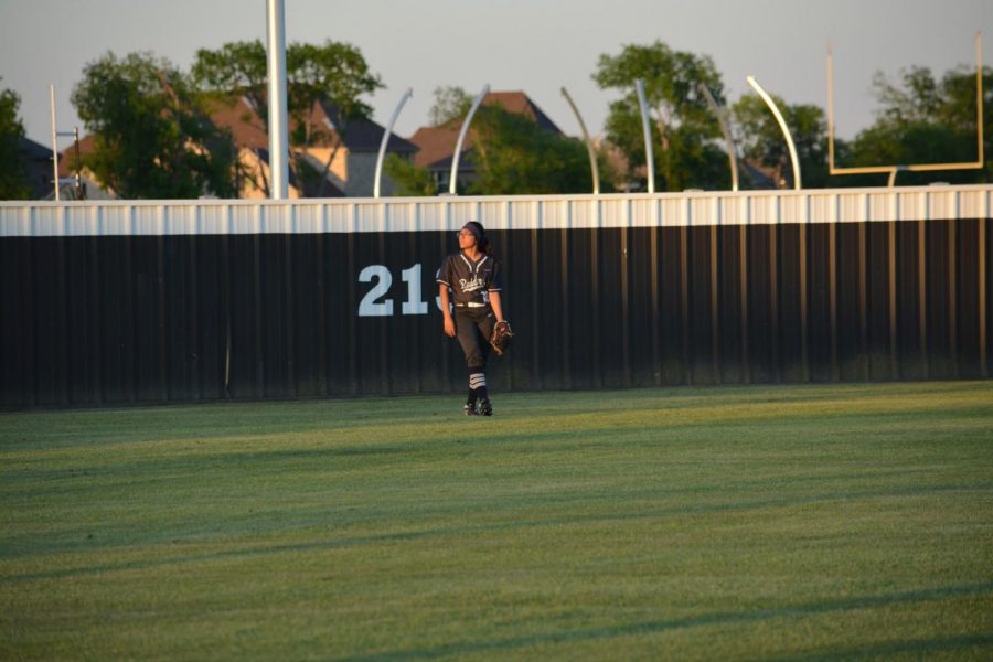 Last time \\ Waiting to catch the ball for the very last time, senior Victoria Perez plays in her last softball game for the varsity team April 26. The team fell to Frisco Independence 5-4 in the second round of the playoffs. “I was very heartbroken to see my team lose, but at the same time, I don’t think we played as well as we could and I hope the upcoming varsity team does better,” Perez said.