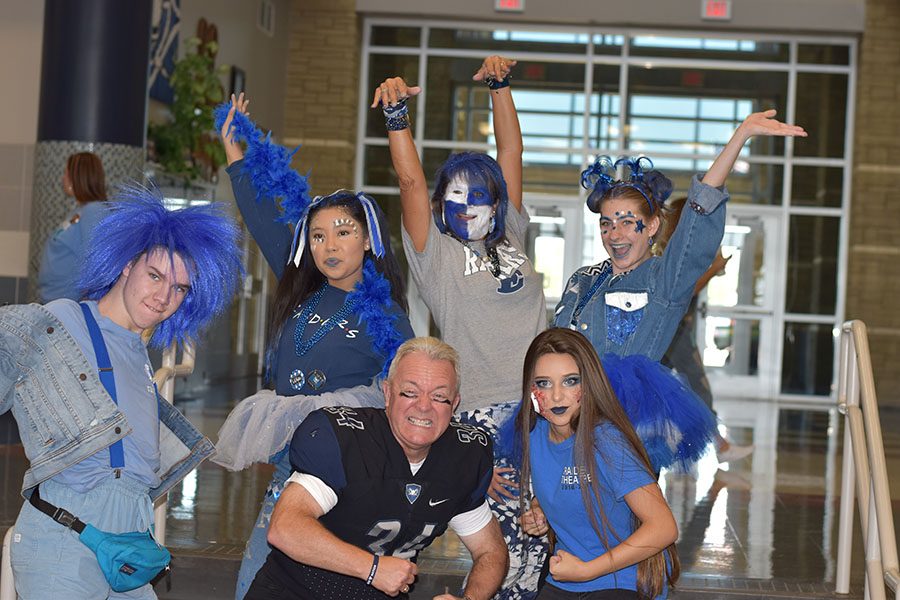All stars // After showing off their ultimate school spirit by dancing, screaming and cheering for the judges with the other finalists, this years top five strutted their stuff with Principal Mike Williams, who was dressed as a football player. “It really makes me feel good and smile seeing the students participate,” said Mr. Williams. “It makes me feel like kids really care about the school. Everyone was smiling because they were having so much fun.” The winners won small prizes.
