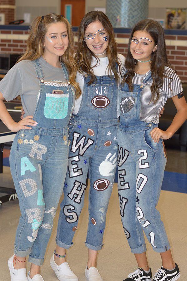 Overspirited \ Waiting for the judges with the other finalists, these students displayed their school spirit with the latest fashion trend. Spirit overalls and jeans are all the craze because each pair is different due to personal touches each student adds.
