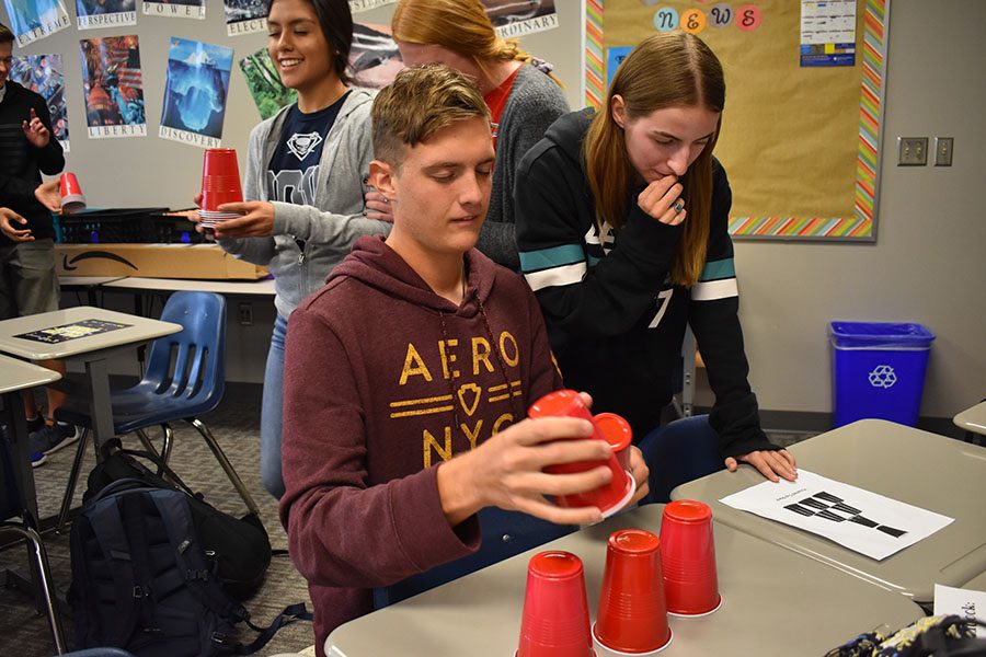 Stacking dreams // Seniors Wylie Dunham and Emily Steigner work together on cup stacking in Mrs. Sharyn Vernon’s English IV class during Wylie Way Day. This years Wylie Way theme is “Level Up” with “Game On” as the theme of the Sept. 12 day. WISD is one of 153 districts to receive an overall score of an A in a new rating system. 