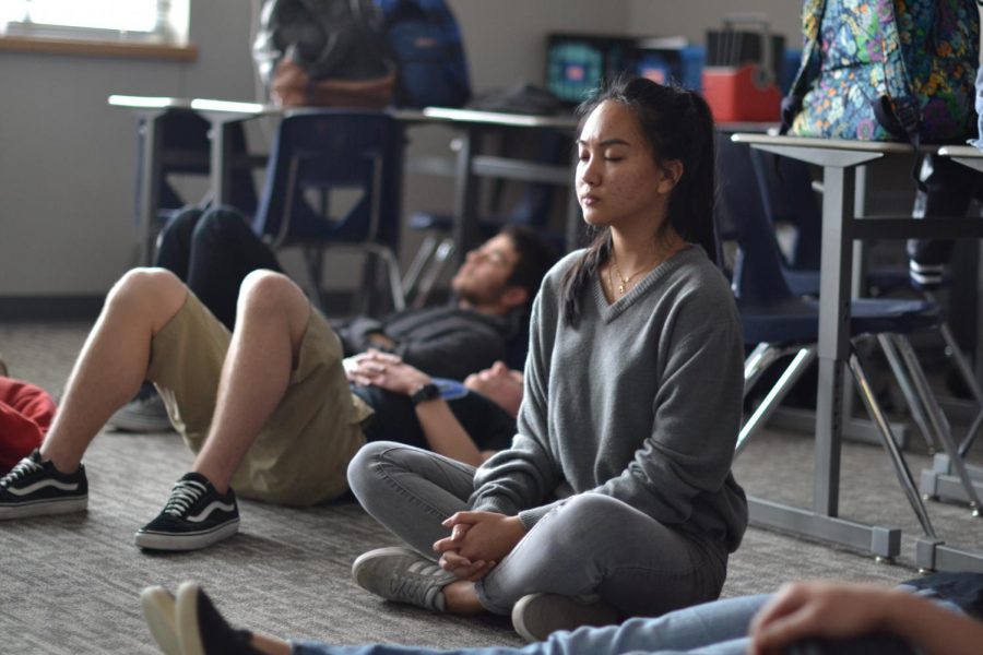 Inhale, exhale \ Feeling calm and collected, senior Nikki Sibala is an active member in the new Yoga Club. Yoga Club meets on Wednesdays in room 916 during A lunch. “I’ve been really stressed this week and Yoga Club has helped relieve me from some of it,” Sibala said.