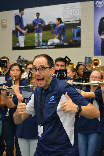 Thumbs up \\  Relishing in his students’ music, Mr. Basset attended all pep rallies as he directs the Pride of the East.  “Reliving the same day is BORING,” Mr. Basset said.