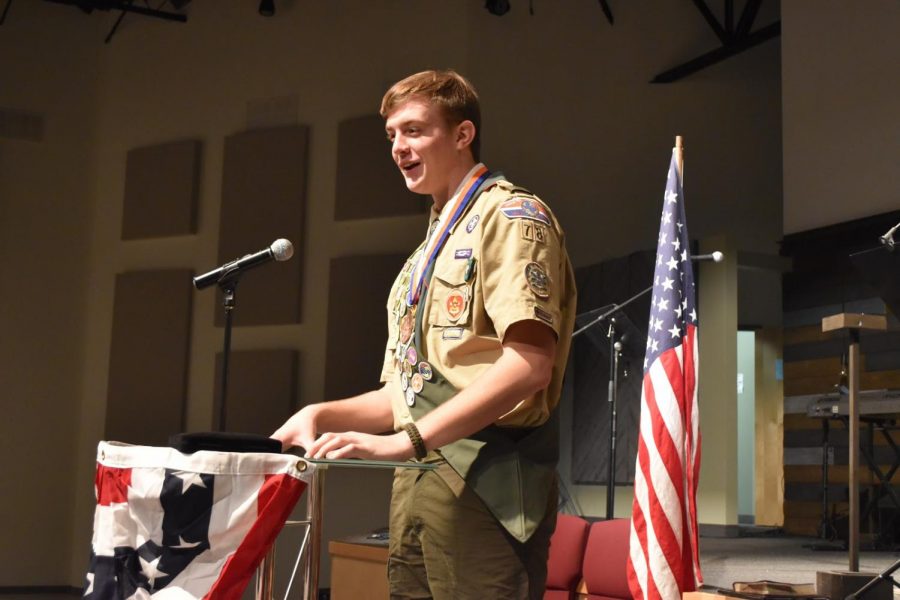 Badged up // Covered in medals, senior Wylie Dunham expresses his gratitude to his family and friends as he receives his rank as Eagle Scout. Dunham has been a Boy Scout for six years and worked hard for the past two years to earn the title of Eagle Scout. “All my time and hard work finally paid off and it’s now going to benefit me in the future,” Dunham said.