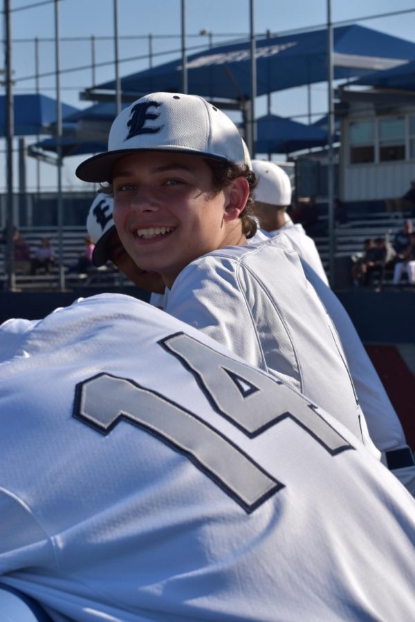 Nothing but smiles  \\ Watching the batters, sophomore Ethan Tuttle gets in the game zone while playing the Leopards.